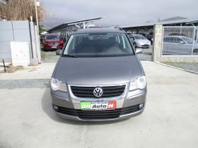     VW Touran 1.9/  ~9 900 .