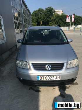     VW Touran ~8 000 .