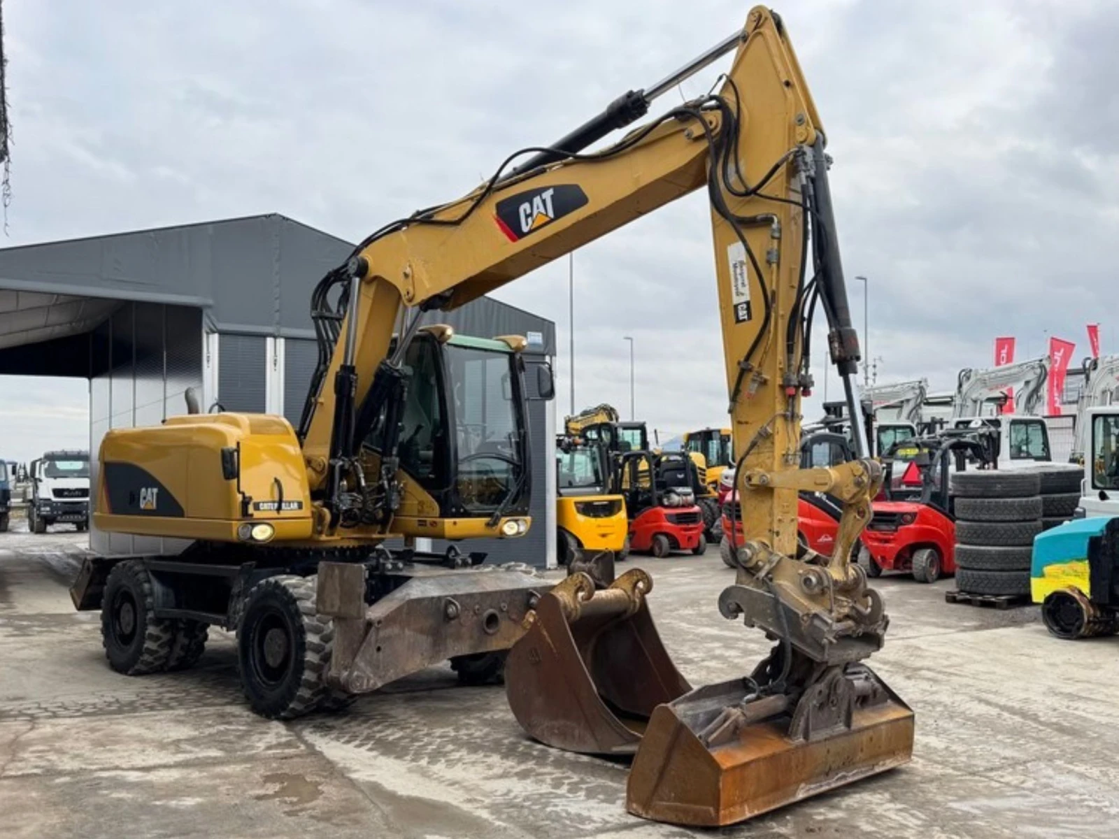 Багер Caterpillar M315D