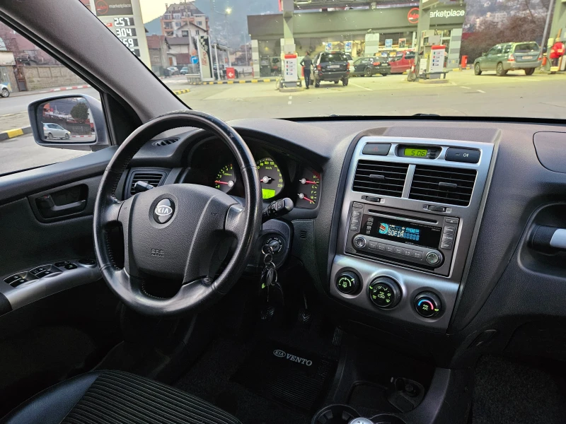 Kia Sportage 2.0 CRDI 4X4/KOJA/6skorosti, снимка 10 - Автомобили и джипове - 48502361