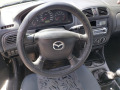 Mazda 323  - изображение 8