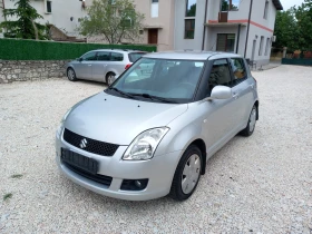 Suzuki Swift 4x4 климатик 1.3i 90кс, снимка 16