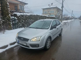     Ford Focus 1.6.- -  