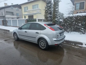     Ford Focus 1.6.- -  