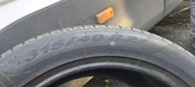 Гуми Зимни 295/35R21, снимка 9