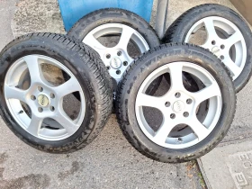 Гуми с джанти Dunlop 205/55R16, снимка 2 - Гуми и джанти - 47714124