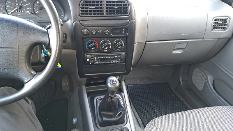 Kia Sportage 2.0, снимка 12 - Автомобили и джипове - 47059347