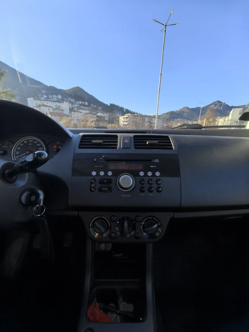 Suzuki Swift 1.3ddis, снимка 13 - Автомобили и джипове - 48522184