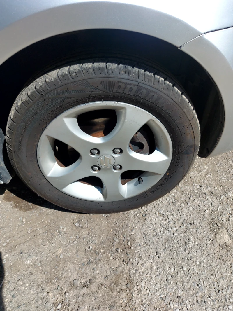 Suzuki Swift 1.3бензин 4х4 , снимка 13 - Автомобили и джипове - 52662701