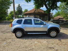Обява за продажба на Dacia Duster 1.6i КЛИМАТИК
