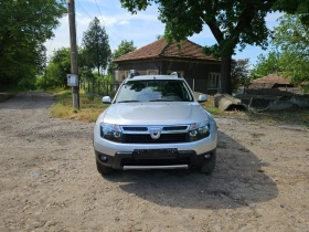 Обява за продажба на Dacia Duster 1.6i КЛИМАТИК