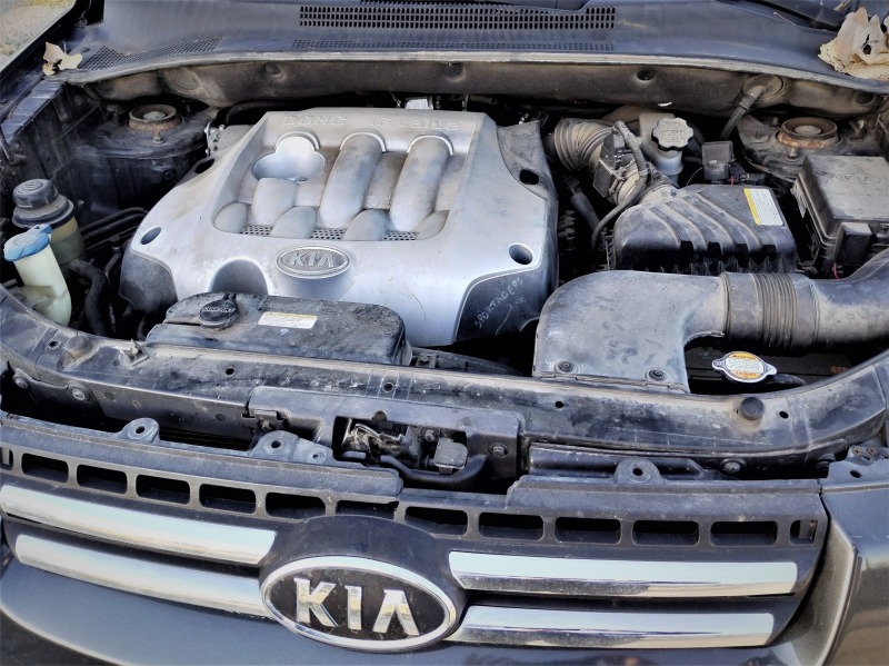 Kia Sportage 2.0 газ 4x4, снимка 11 - Автомобили и джипове - 46415001
