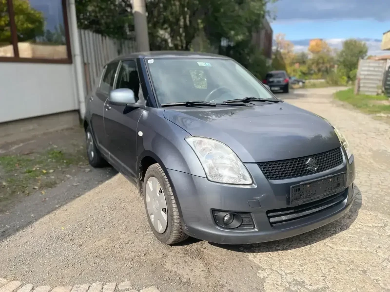 Suzuki Swift 1.3i 4X4, снимка 2 - Автомобили и джипове - 47627740