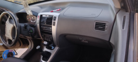 Hyundai Tucson 2.0 бензин с газ, снимка 13 - Автомобили и джипове - 43037753