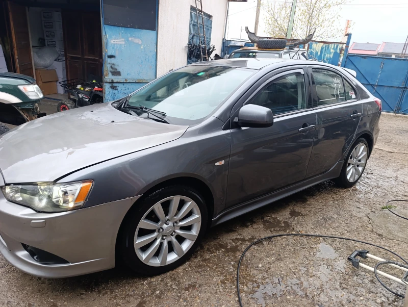 Mitsubishi Lancer 1.8 автомат , кожа ксенон , снимка 2 - Автомобили и джипове - 49731825
