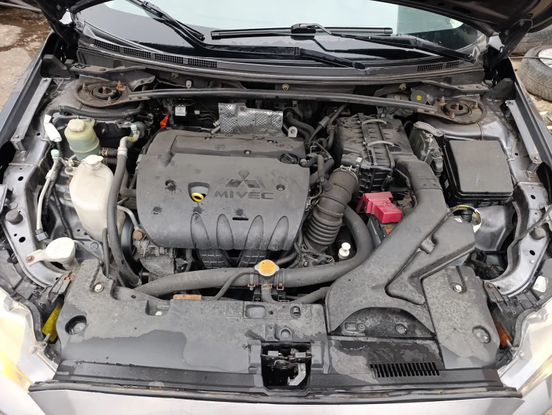 Mitsubishi Lancer 1.8 автомат , кожа ксенон , снимка 6 - Автомобили и джипове - 49731825