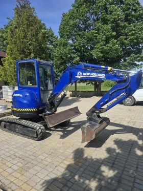 Багер New Holland Е 35