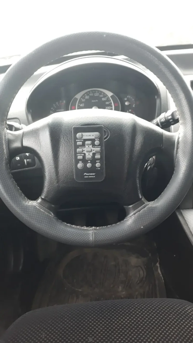 Hyundai Tucson 2.0 i Gaz 4x4, снимка 7 - Автомобили и джипове - 48248795