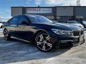 BMW 750 * Масажи * Harman Kardon * Фиксирана цена до БГ * , снимка 1