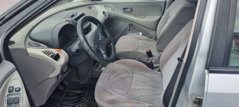 Nissan Almera tino, снимка 8 - Автомобили и джипове - 52496573