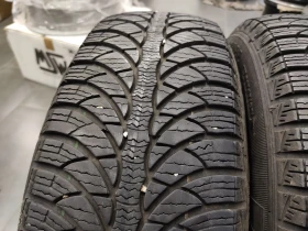 Гуми Зимни 175/65R14, снимка 1 - Гуми и джанти - 47489995