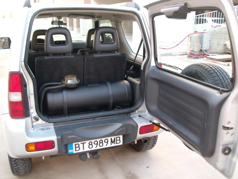 Suzuki Jimny 1.3i Klimatik  ITALIQ 4x4 OTLICHNO SASTOQNIE, снимка 12 - Автомобили и джипове - 48345545