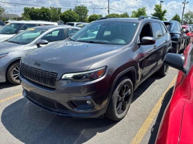 ������ Jeep Cherokee