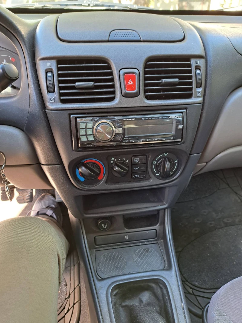 Nissan Almera, снимка 12 - Автомобили и джипове - 47825534