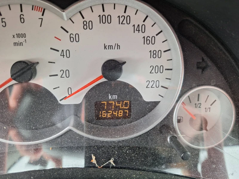 Opel Corsa 1.2i 75 к.с.5 врати , снимка 12 - Автомобили и джипове - 53293574