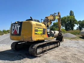      Caterpillar 323E LN