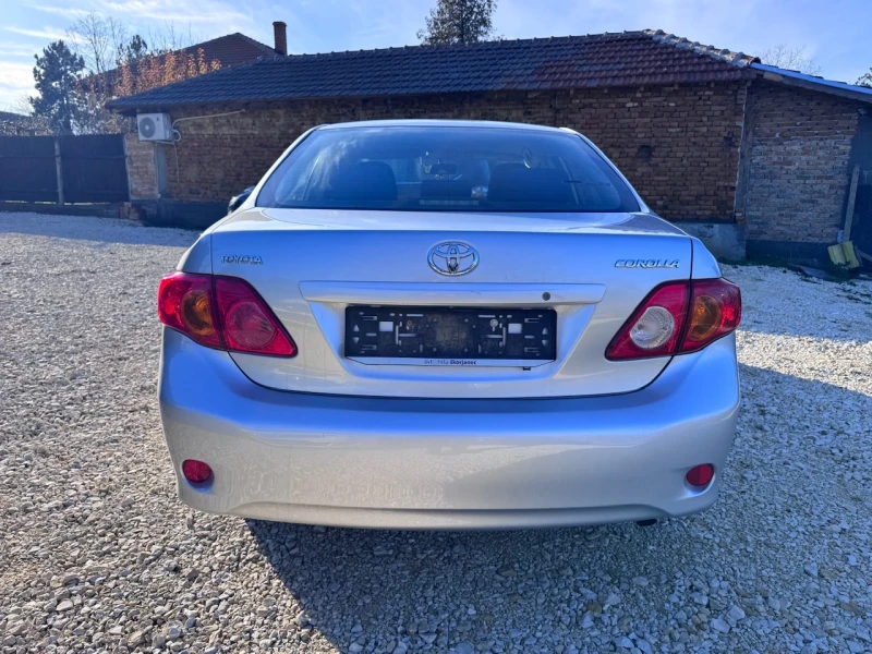 Toyota Corolla 1.6i Климатроник, снимка 4 - Автомобили и джипове - 52851570